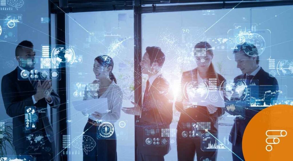 Team di professionisti che discutono di innovazione tecnologica supportata dal bando trasformazioni della regione Puglia.